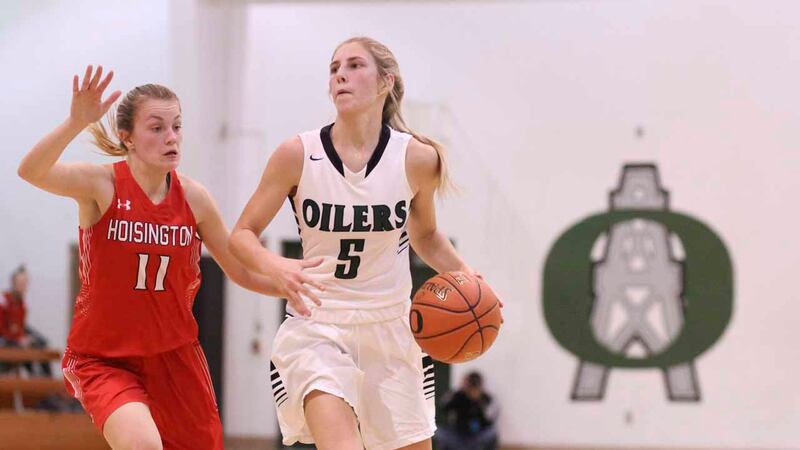Central Plains Lady Oiler #5 Kassidy Nixon brings the ball around as Hoisington Lady Cardinal...