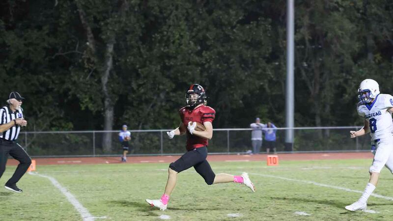 Ellsworth Bearcat #4 Landin Johnson scores a touchdown. The Ellsworth Bearcats defeated the...