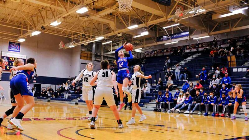 Hugoton Lady Eagle #12 Gianna Vos jumps up for a layup. The Hugoton Lady Eagles defeated the...